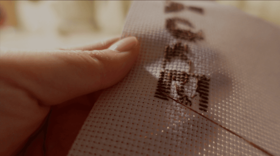 Trimming the excess thread close to the fabric